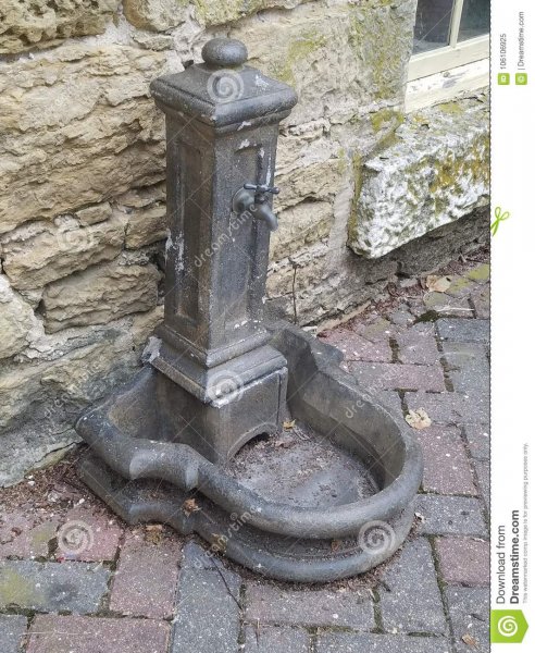 old-fountain-old-fountain-outside-rock-wall-brick-sidewalk-106106925.jpg